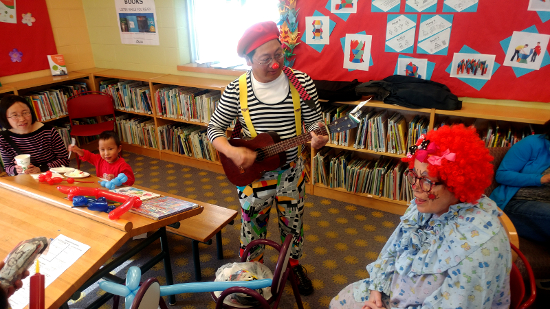Toronto Public Library, Centennial Branch (Bathurst/Finch), Open House, Scarborough Corp of Clowns Deigo and Junebug singing some songs. Photo by Nisha Prajapati
